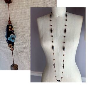 Brown and blue lampwork beads and square beads on a long chic necklace